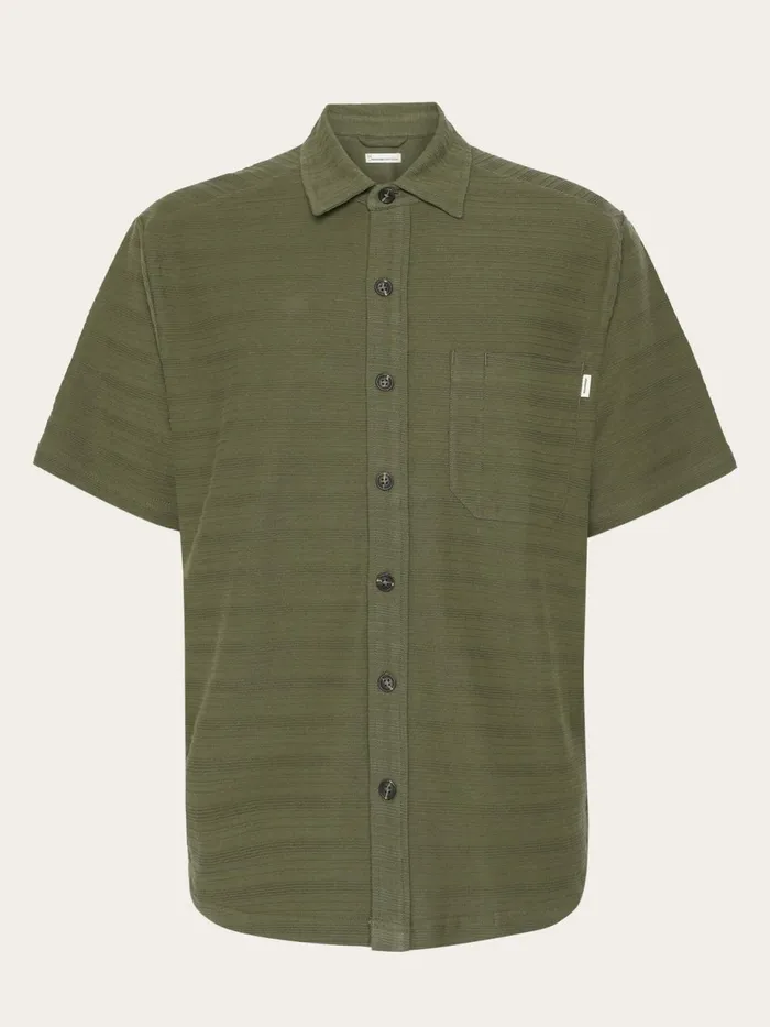 KnowledgeCotton Apparel Shirts Loose Short Sleeve Cotton Solid Striped Jersey Shirt GOTSVegan Burned Olive 8211 Men KnowledgeCotton Apparel Shirts Loose Short Sleeve Cotton Solid Striped Jersey Shirt GOTSVegan Burned Olive 8211 Men