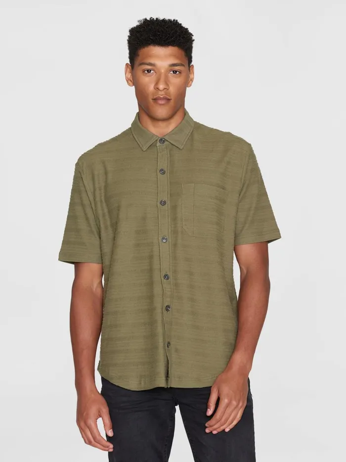 KnowledgeCotton Apparel Shirts Loose Short Sleeve Cotton Solid Striped Jersey Shirt GOTSVegan Burned Olive 8211 Men KnowledgeCotton Apparel Shirts Loose Short Sleeve Cotton Solid Striped Jersey Shirt GOTSVegan Burned Olive 8211 Men