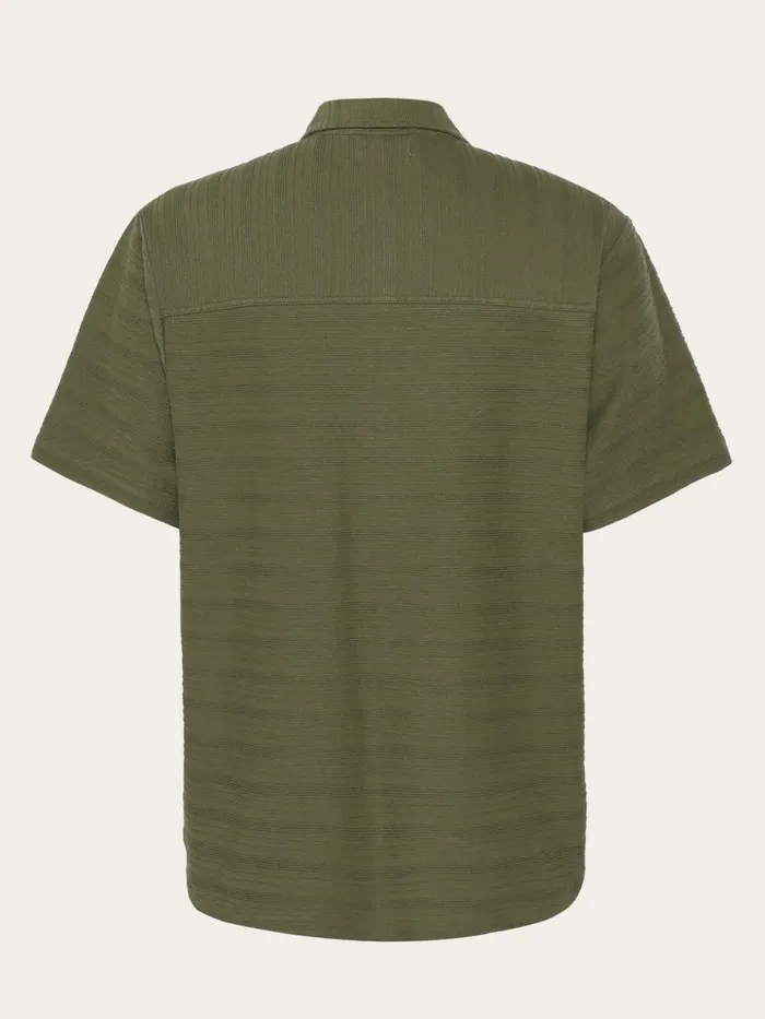 KnowledgeCotton Apparel Shirts Loose Short Sleeve Cotton Solid Striped Jersey Shirt GOTSVegan Burned Olive 8211 Men KnowledgeCotton Apparel Shirts Loose Short Sleeve Cotton Solid Striped Jersey Shirt GOTSVegan Burned Olive 8211 Men
