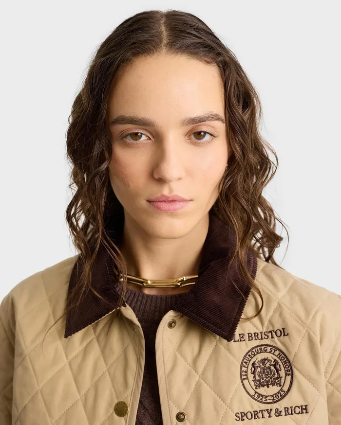 Sporty and Rich Coats Women Crest Seal 100th Quilted Jacket 8211 BeigeChocolate
