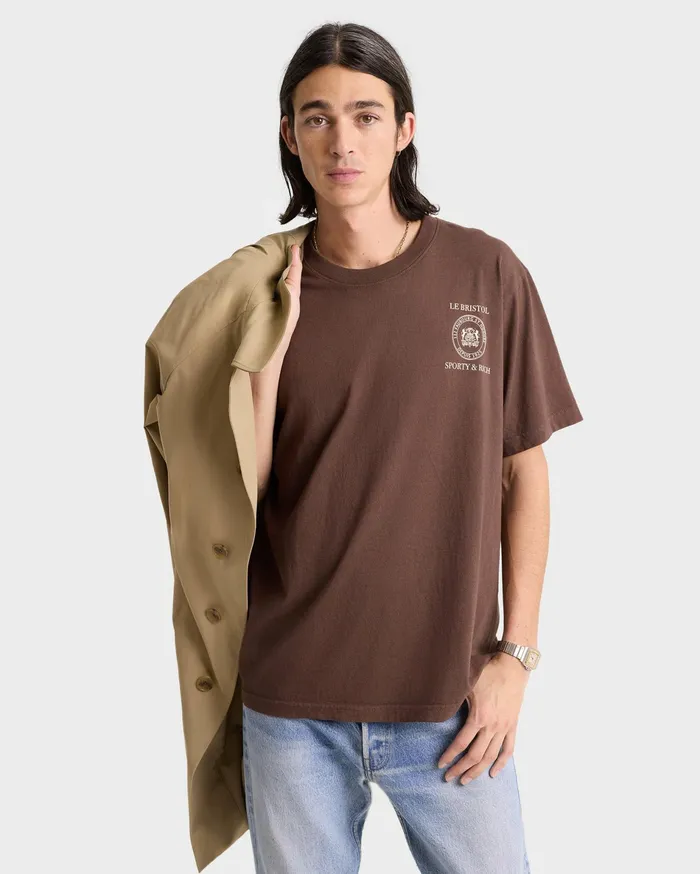Sporty and Rich TShirts Men Crest Seal 100th T Shirt 8211 ChocolateCream