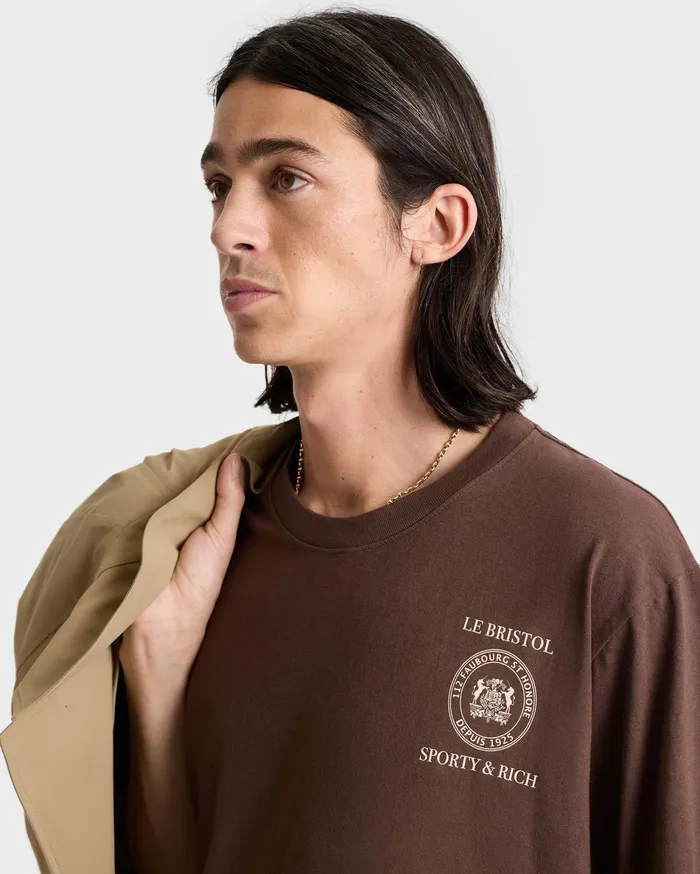 Sporty and Rich TShirts Men Crest Seal 100th T Shirt 8211 ChocolateCream