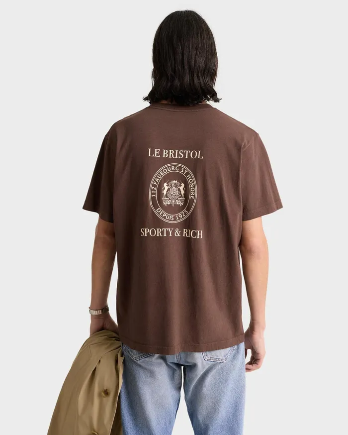 Sporty and Rich TShirts Men Crest Seal 100th T Shirt 8211 ChocolateCream