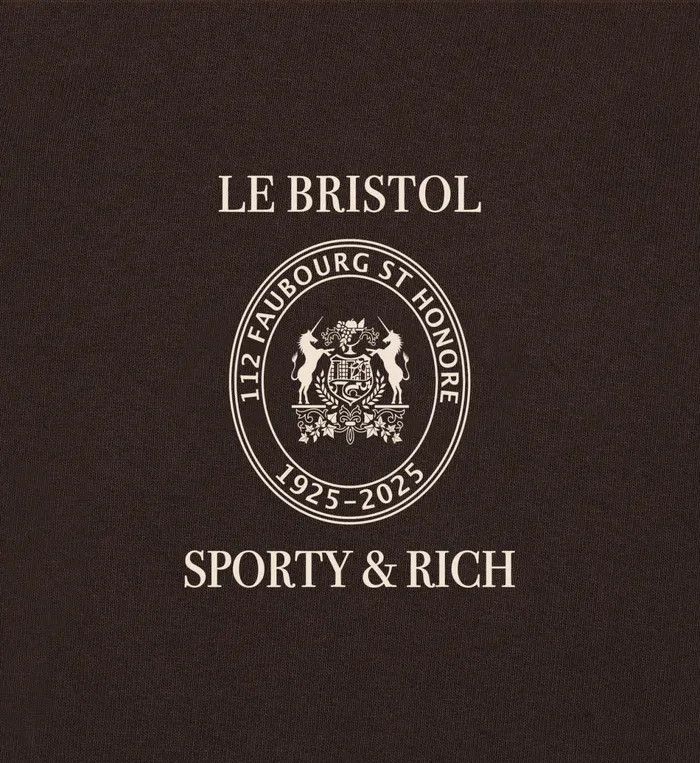 Sporty and Rich TShirts Men Crest Seal 100th T Shirt 8211 ChocolateCream
