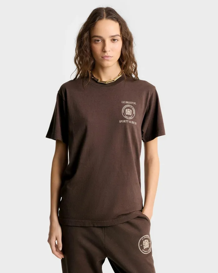 Sporty and Rich TShirts Men Crest Seal 100th T Shirt 8211 ChocolateCream