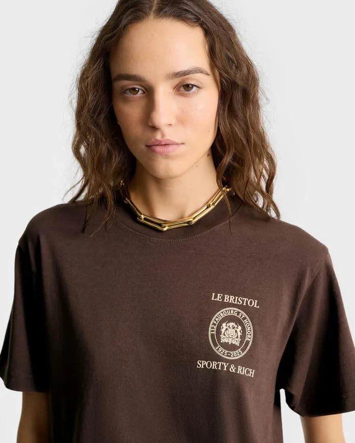 Sporty and Rich TShirts Men Crest Seal 100th T Shirt 8211 ChocolateCream