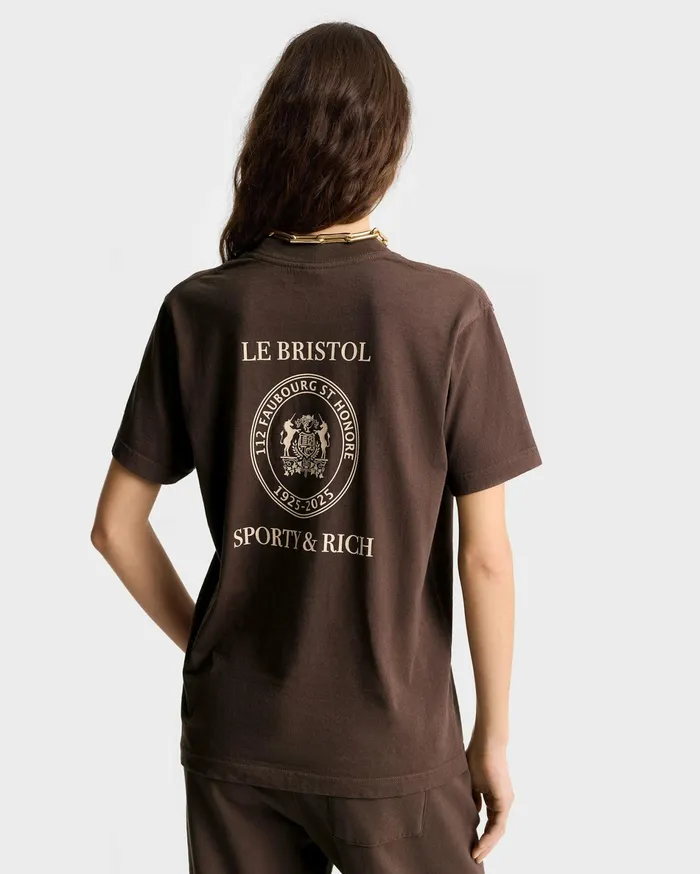 Sporty and Rich TShirts Men Crest Seal 100th T Shirt 8211 ChocolateCream